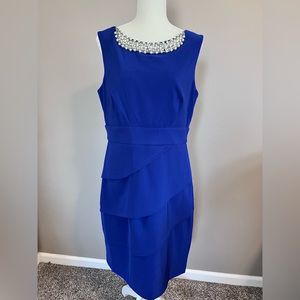 Macys Womens cocktail dress. Knee length. Blue with pearl neckline. Size 12